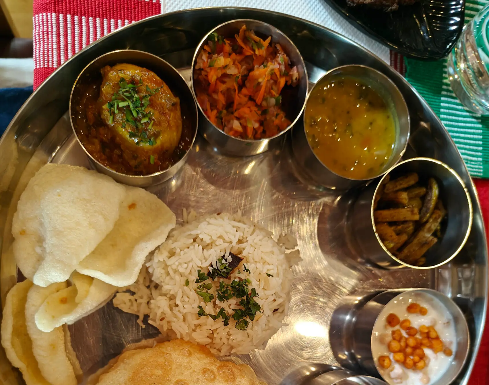 Traditional Indian thali with various dishes