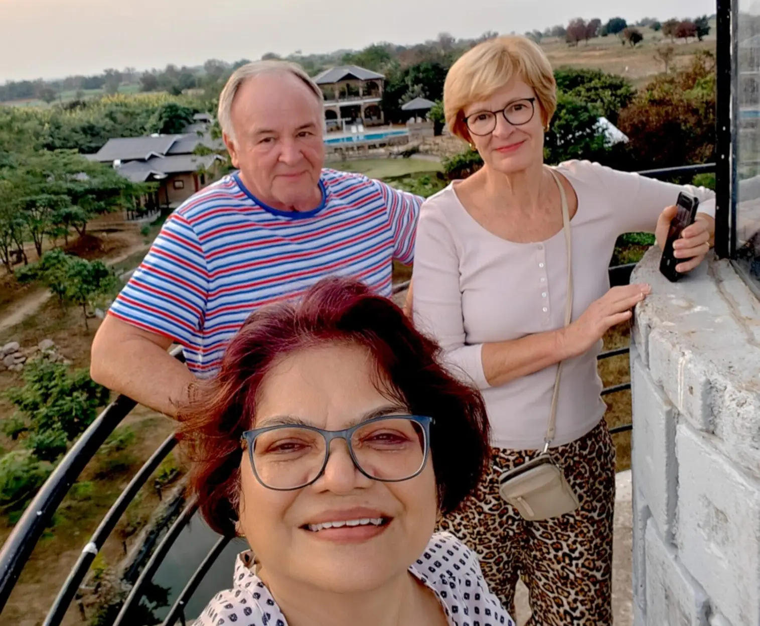 Group of people on a balcony.