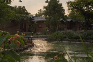Serene landscape with water and cottages